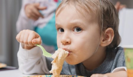 boy-eating-cake-birthday-party