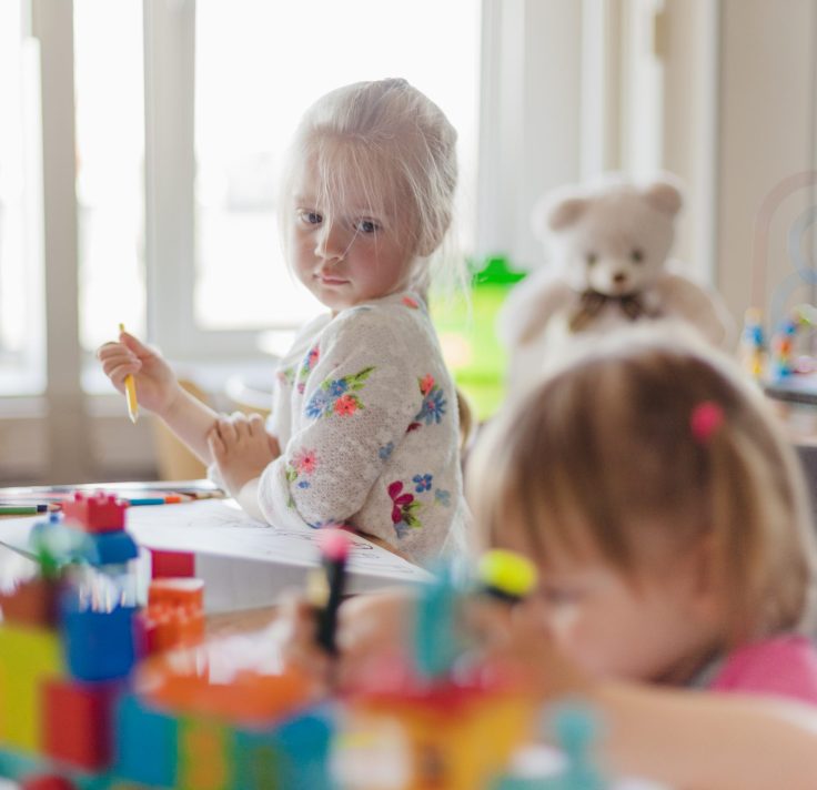 little-girl-drawing-sitting-table